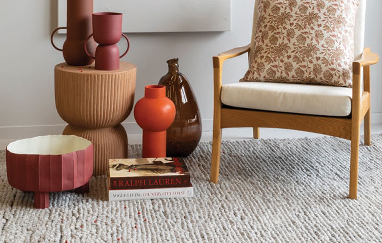 Tonal greys in the flooring and walls showcase accessories