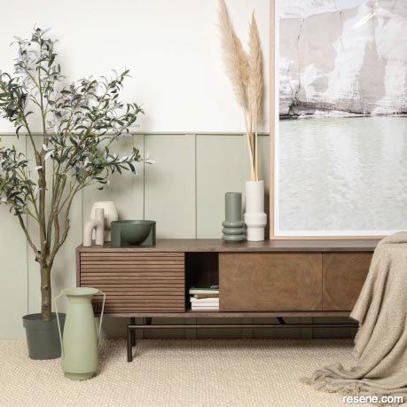 A coastal living room in soft green Resene Bud