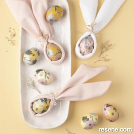 Make eggs with paper cutouts and bunny ears