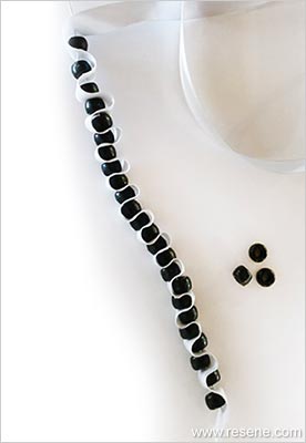 Thread on more beads
