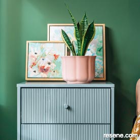Update your bedside table with a coat of paint and wallpaper lined drawers